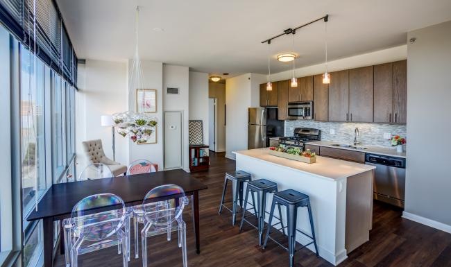 a kitchen with a table and chairs