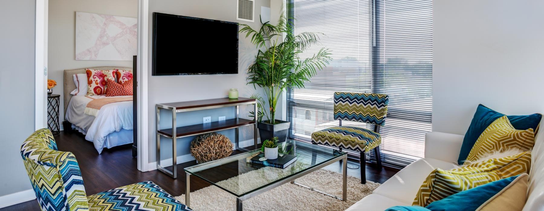 a living room with a tv and couches