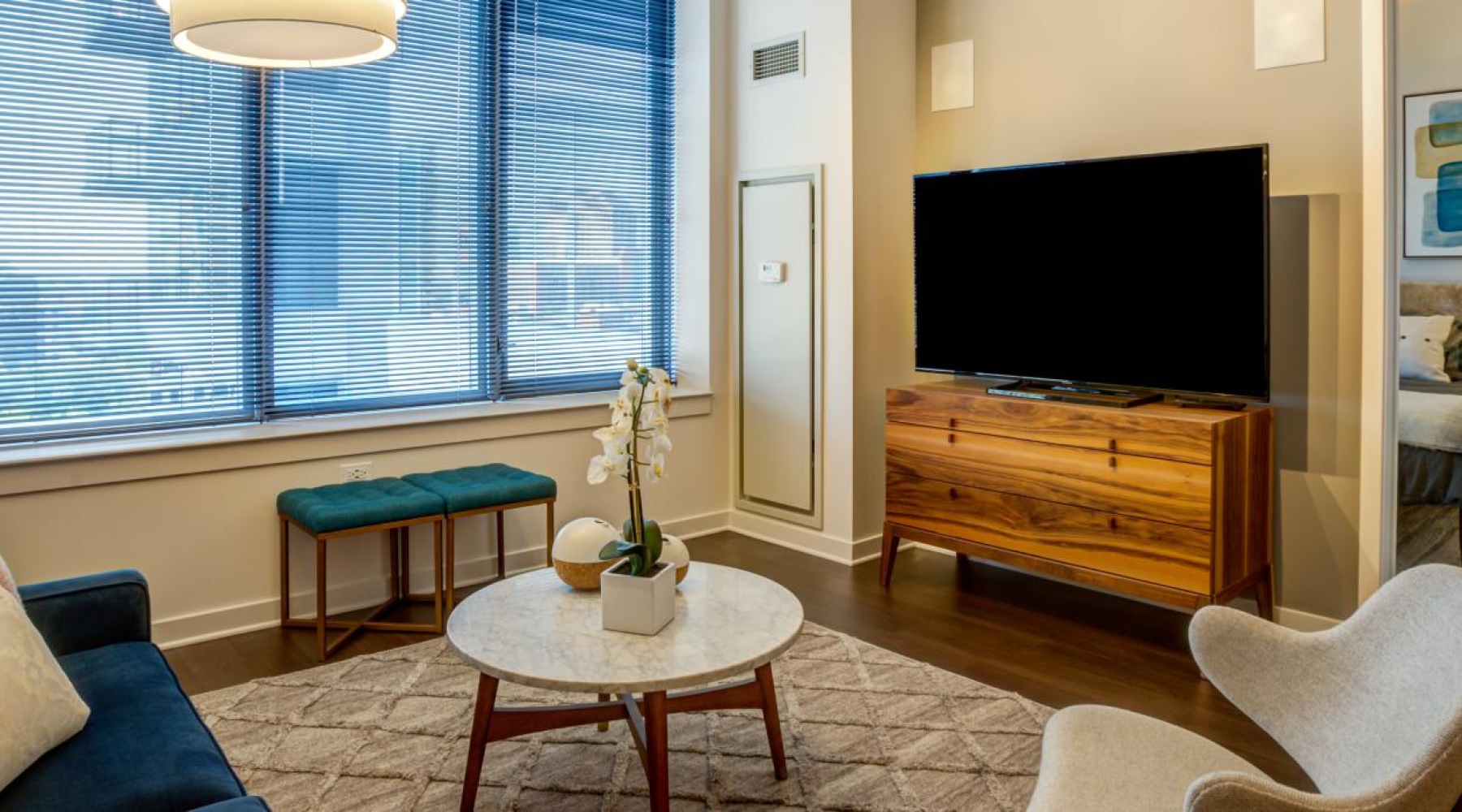 a living room with a tv and couches
