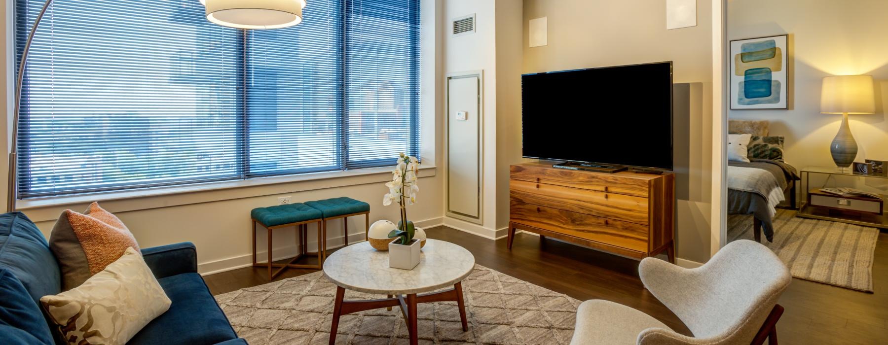 a living room with a tv and couches