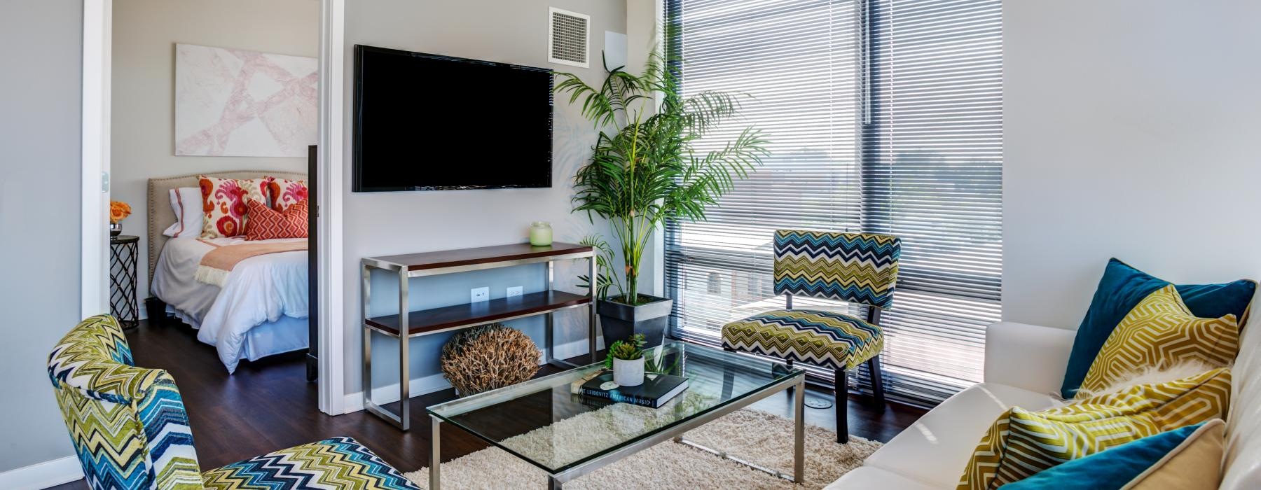 a living room with a tv and couches